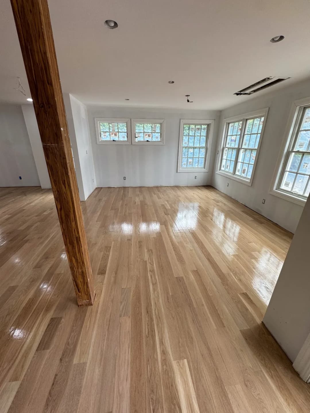 Hardwood floor refinishing project by Summit Home Services