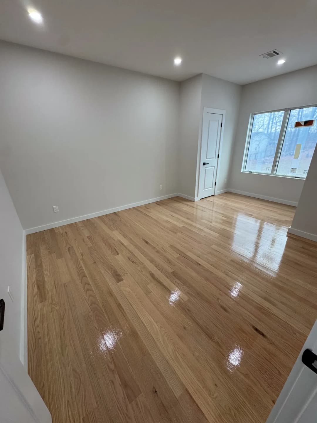 Hardwood floor refinishing project by Summit Home Services