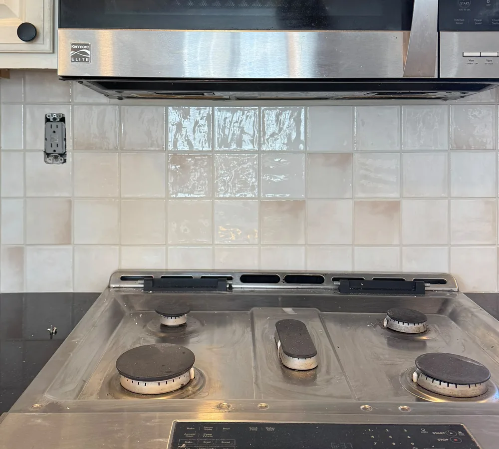 After: the same wall with a cream square handmade-look tile backsplash, by Summit Home Services