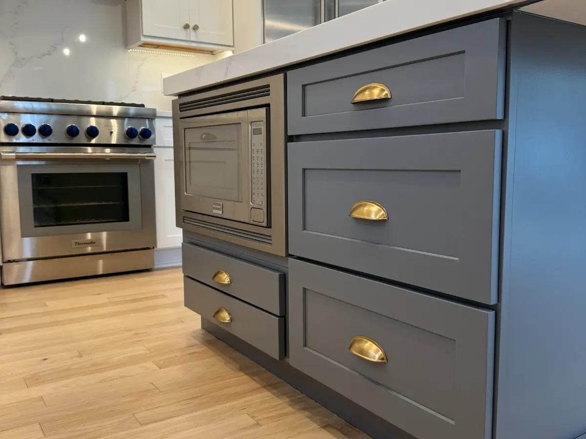 Gray island with gold hardware cabinet project